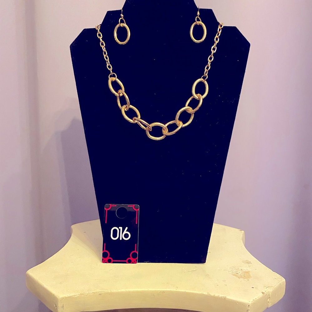 This gold color necklace & matching earings helps make any outfit fun and flirty